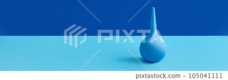 Blue rubber enema on table with copy space. Medical treatment concept Blue rubber enema on table with copy space. Medical treatment concept 105041111