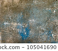 The texture of an old concrete wall, painted over with strokes of light brown and blue paint for background and design. Photo 105041690