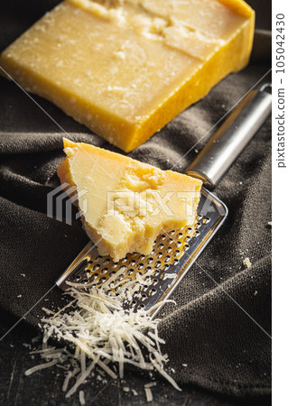 Tasty parmesan cheese. Grated cheese. 105042430