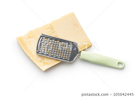 Tasty parmesan cheese and grater isolated on white background. 105042445