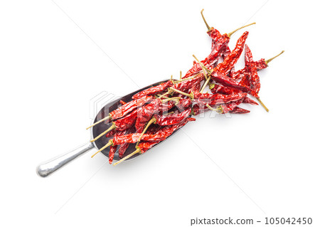 Red chili peppers in scoop isolated on white background. 105042450