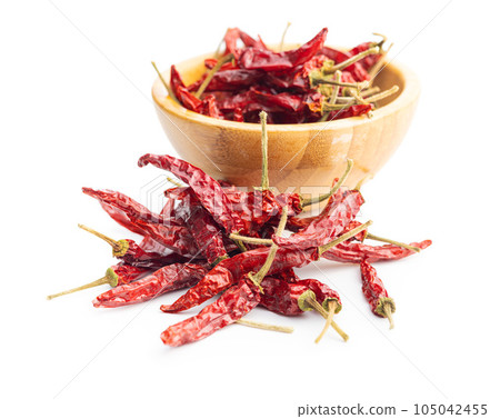 Red chili peppers isolated on white background. Red chili peppers isolated on white background. 105042455