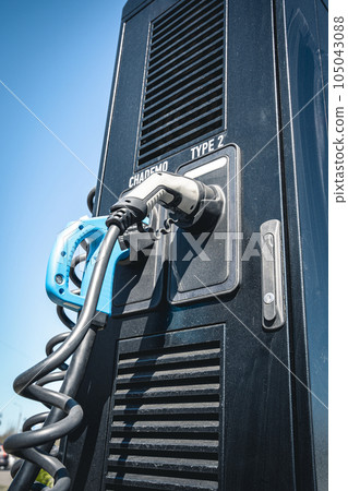 Electric vehicle Charging station . plug-in power cable. Electric vehicle Charging station . plug-in power cable. 105043088