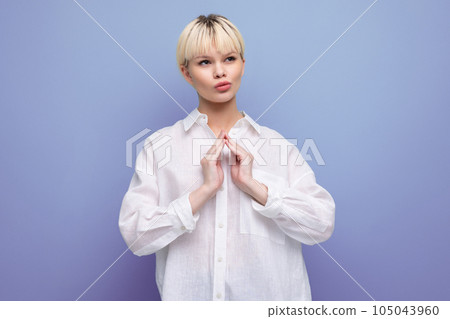 young pretty blonde businesswoman in white shirt isolated background with copy space. people young pretty blonde businesswoman in white shirt isolated background with copy space. people 105043960