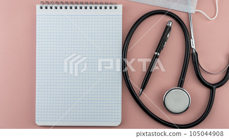 medical supplies and Notepad on a pink background, isolates,mock up medical supplies and Notepad on a pink background, isolates,mock up 105044908