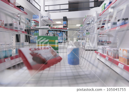 Store basket filled with pharmaceutics and pills ready to be buy by clients during checkup visit in drugstore. Pharmacy also carried a variety of other medical products, bandages and cold medicine. Store basket filled with pharmaceutics and pills ready to be buy by clients during checkup visit in drugstore. Pharmacy also carried a variety of other medical products, bandages and cold medicine. 105045755