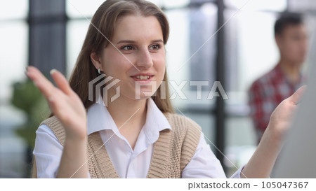 The girl looks thoughtfully at the laptop monitor. Online work. The girl looks thoughtfully at the laptop monitor. Online work. 105047367