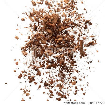 Coconut peel husk flying explosion, coconut chopped medium M size abstract fall down garden. Coconut shell peel fertilizer splash throwing in Air. White background Isolated high speed shutter, freeze 105047720