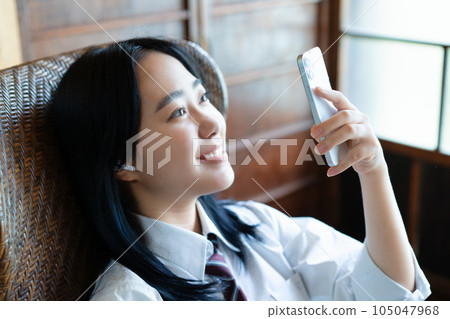 School girls listening to music School girls listening to music 105047968