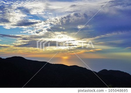 The sun setting over the Sea of Japan from the Mt. Kinpoku Trail 105048695