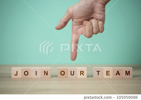 Job recruiting advertisement. represented by 'JOIN OUR TEAM' texts on the block. and hand point down to wood block 105050086