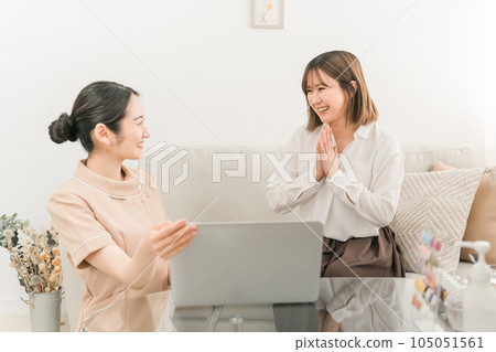 Japanese woman consulting with a counselor staff who offers counseling at a beauty salon Japanese woman consulting with a counselor staff who offers counseling at a beauty salon 105051561