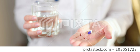 Woman doctor offers to take pill for cure illness. Woman doctor offers to take pill for cure illness. 105051722