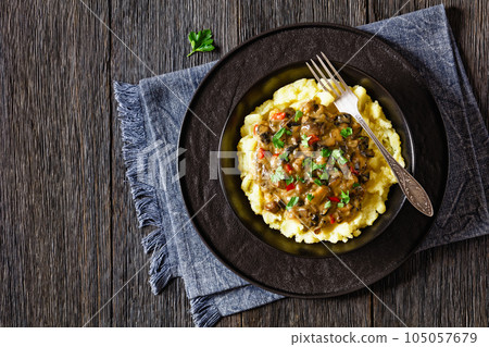 potato mash topped with mushroom gravy in bowl potato mash topped with mushroom gravy in bowl 105057679