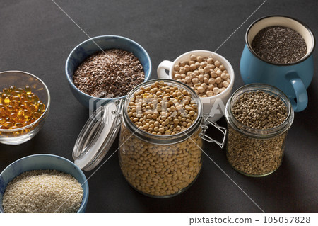 Source of vitamin E and nutrients in bowls on the table, copy space 105057828