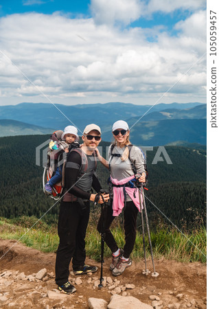 A family with a baby in the mountains A family with a baby in the mountains 105059457