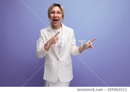 emotional young blond employer woman in a white elegant jacket and skirt screaming pointing her emotional young blond employer woman in a white elegant jacket and skirt screaming pointing her 105062011