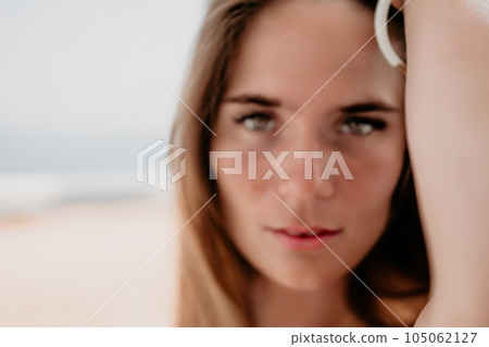 Happy woman portrait in cafe. Boho chic fashion style. Outdoor photo of young happy woman with long hair, sunny weather outdoors sitting in modern cafe. Happy woman portrait in cafe. Boho chic fashion style. Outdoor photo of young happy woman with long hair, sunny weather outdoors sitting in modern cafe. 105062127