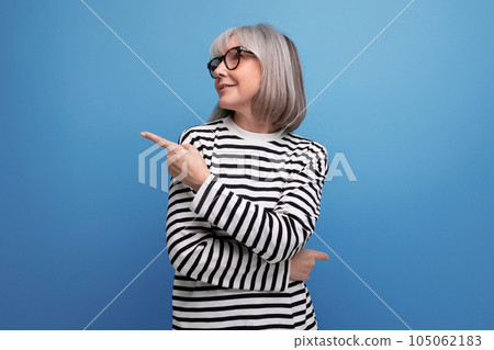 portrait of an old woman with gray hair in a fashionable image on a bright studio background portrait of an old woman with gray hair in a fashionable image on a bright studio background 105062183