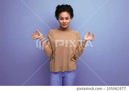 isolated background, well groomed pretty young brunette hispanic woman with ponytail hairstyle 105062877