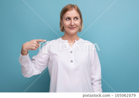beautiful cute blond middle aged woman in white blouse in premenopausal age beautiful cute blond middle aged woman in white blouse in premenopausal age 105062879