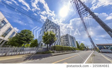One-lane road with bright sunshine 105064081
