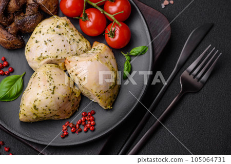 Delicious juicy grilled chicken with salt, spices and herbs with vegetables 105064731