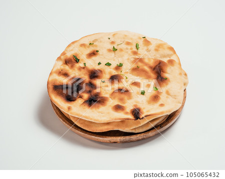 naan flatbreads isolated on white background naan flatbreads isolated on white background 105065432