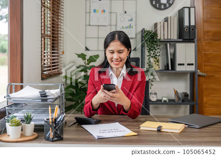 Beautiful business asian woman with working office desk using phone and computer laptop Beautiful business asian woman with working office desk using phone and computer laptop 105065452