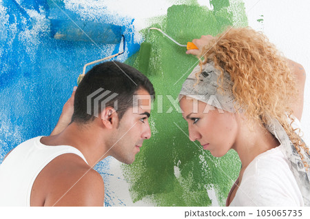 Portrait of couple painting at home Portrait of couple painting at home 105065735