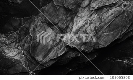 黑色和白色岩石紋理。深灰色石頭，花崗岩背景設計。破裂的粗糙山面。爪 105065808