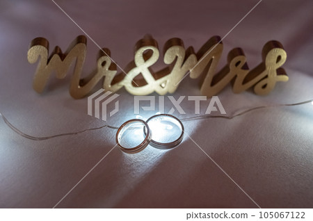 Two wedding rings illuminated backlight with beautiful bokeh, close-up photo Two wedding rings illuminated backlight with beautiful bokeh, close-up photo 105067122