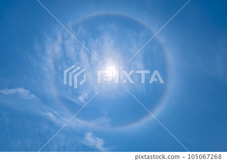 Cityscape of Yokohama, Japan A rainbow-colored ring of light "halo" that appears around the sun = Observed in Yokohama City 105067268