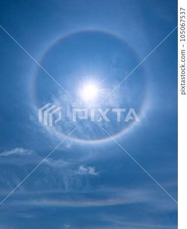 Cityscape of Yokohama, Japan A rainbow-colored ring of light "Halo" that appears around the sun and a rainbow that appears below it = Observed in Yokohama City 105067537