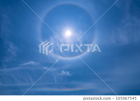 Cityscape of Yokohama, Japan A rainbow-colored ring of light "Halo" that appears around the sun and a rainbow that appears below it = Observed in Yokohama City 105067545