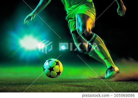 Soccer players sprinting with ball. Footballers at match kick. Young ones chasing the ball. 105068086