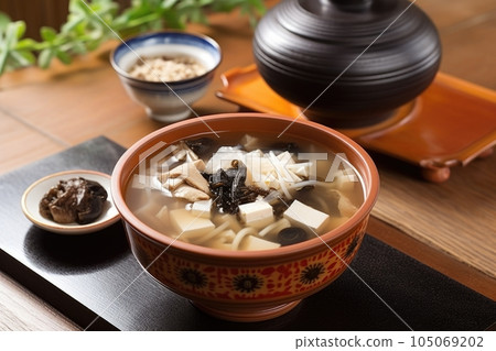 tofu soup, with rice noodles and mushrooms, in a traditional japanese setting, created with generative ai 105069202