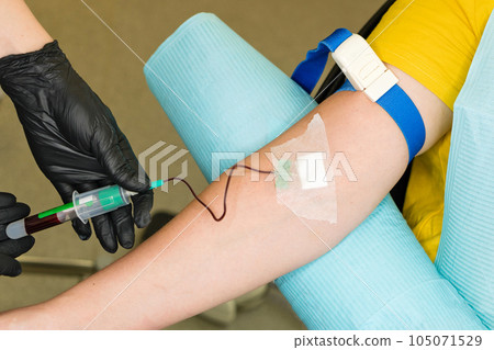 osmetologist holds test tube with blood osmetologist holds test tube with blood 105071529