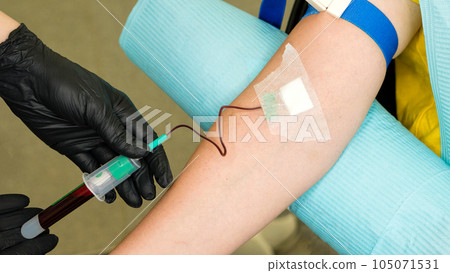 osmetologist holds test tube with blood osmetologist holds test tube with blood 105071531