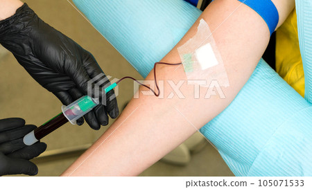 osmetologist holds test tube with blood osmetologist holds test tube with blood 105071533
