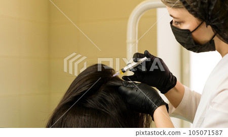 osmetologist holds test tube with blood osmetologist holds test tube with blood 105071587