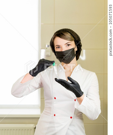 osmetologist holds test tube with blood osmetologist holds test tube with blood 105071593