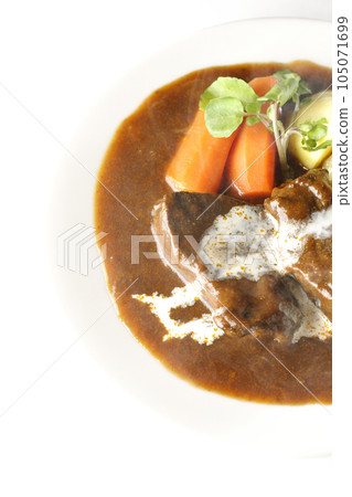 Watercress, carrots, potatoes and hot cream-covered thick-sliced beef tongue over a white background Watercress, carrots, potatoes and hot cream-covered thick-sliced beef tongue over a white background 105071699