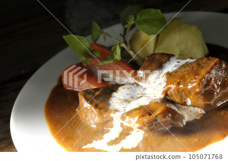 Hot Beef Stew with Watercress, Carrot, Potato Garnish and Thick Cut Beef Tongue Covered with Cream 105071768