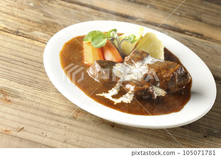 Hot Beef Stew with Watercress, Carrot, Potato Garnish and Thick Cut Beef Tongue Covered with Cream 105071781