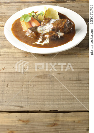 Hot Beef Stew with Watercress, Carrot, Potato Garnish and Thick Cut Beef Tongue Covered with Cream 105071792