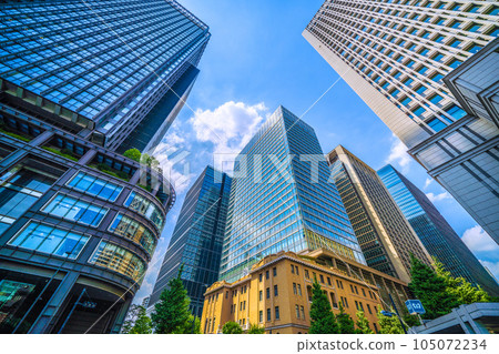 Tokyo cityscape in Japan July. Extreme heat...A business district in Marunouchi, Tokyo. The Shin-Marunouchi Building is on the left. (Otemachi is on the right side of the screen) 105072234
