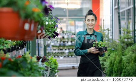 Black-haired assistant fills department with pot-plants 105073770