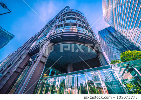 Tokyo cityscape in Japan July. Intense heat... View of Tokyo Station reflected in the glass windows of Marunouchi, Tokyo, and the Shin-Marunouchi Building Tokyo cityscape in Japan July. Intense heat... View of Tokyo Station reflected in the glass windows of Marunouchi, Tokyo, and the Shin-Marunouchi Building 105073773