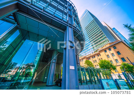 Tokyo cityscape in Japan July. Intense heat... View of Tokyo Station reflected in the glass windows of Marunouchi, Tokyo, and the Shin-Marunouchi Building Tokyo cityscape in Japan July. Intense heat... View of Tokyo Station reflected in the glass windows of Marunouchi, Tokyo, and the Shin-Marunouchi Building 105073781